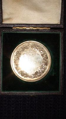 The back of the medal
THE ROYAL
HORTICULTURAL SOCIETY
 MR. J. PLUCK
For
Desert Apples
1875
the medal is for merit ie: bronze  
made by  W J Taylor . 
medalist  of Red Lion Street London

